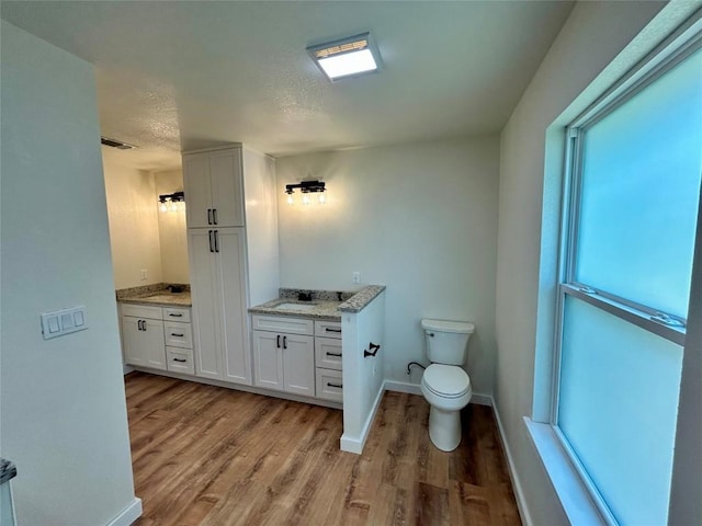 1127 Greenhill Dr, Canyon Lake, TX 78133 - bathroom featuring vanity and wood finished floors