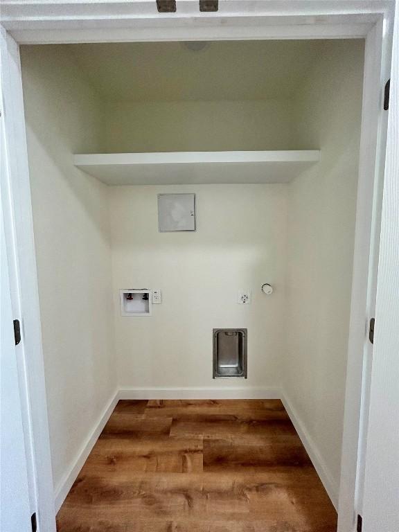 1127 Greenhill Dr, Canyon Lake, TX 78133 - laundry area with gas dryer hookup and wood finished floors