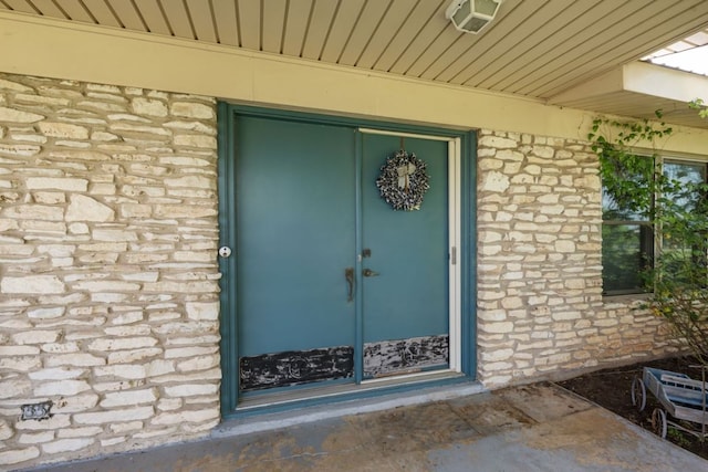 401 Patriot Way, Georgetown, TX 78626 - doorway to property with stone siding