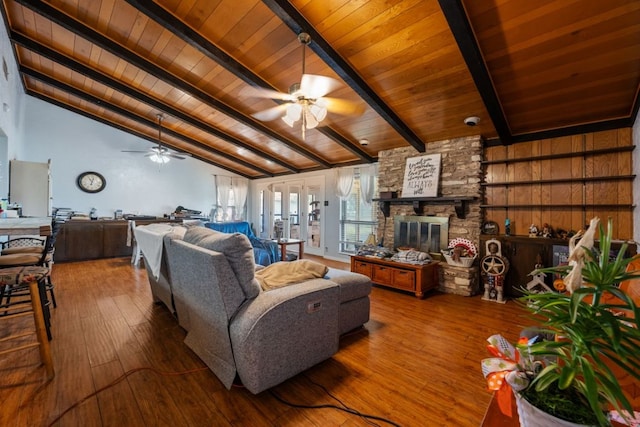 401 Patriot Way, Georgetown, TX 78626 - living room featuring a ceiling fan, wooden ceiling, hardwood / wood-style floors, a fireplace, and french doors
