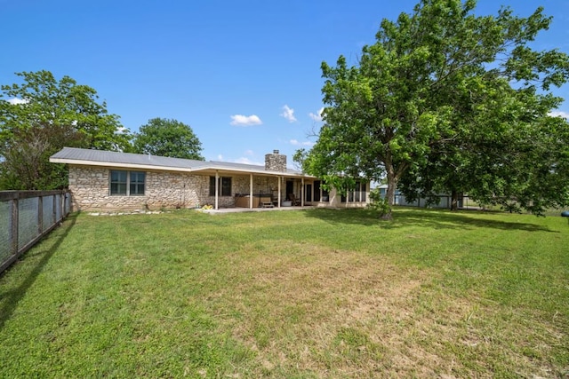 401 Patriot Way, Georgetown, TX 78626 - rear view of property with a chimney, stone siding, and a patio area