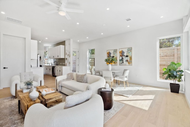 613 Clifford Dr Unit B, Austin, TX 78745 - living area featuring light wood-style flooring, ceiling fan, and recessed lighting