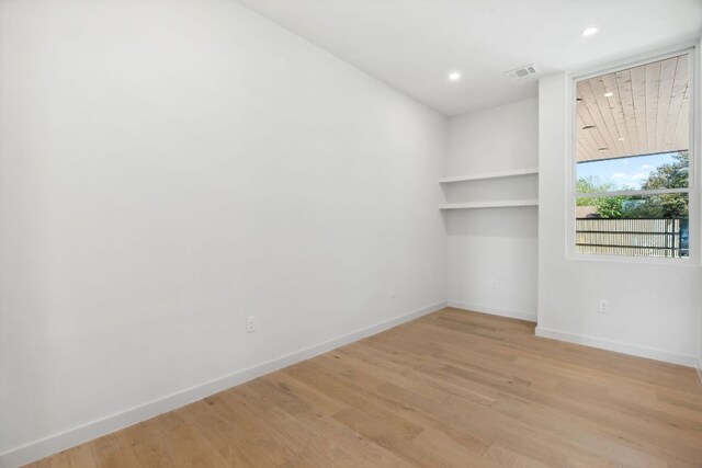 613 Clifford Dr Unit B, Austin, TX 78745 - empty room featuring baseboards, recessed lighting, and light wood-type flooring