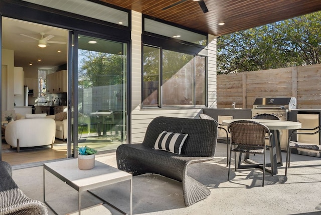 613 Clifford Dr Unit B, Austin, TX 78745 - view of patio with an outdoor kitchen, a grill, fence, ceiling fan, and outdoor dining area