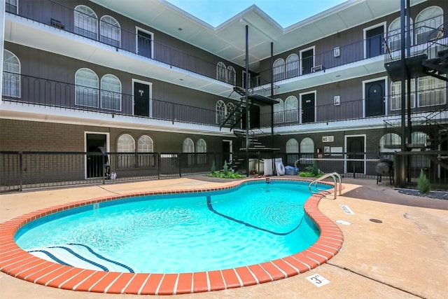 101 E 33rd St Unit 107, Austin, TX 78705 - community pool featuring a patio area and stairway