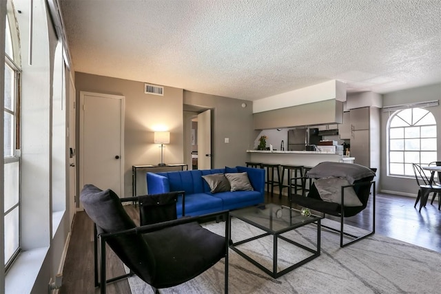 101 E 33rd St Unit 107, Austin, TX 78705 - living room with a textured ceiling and light wood finished floors