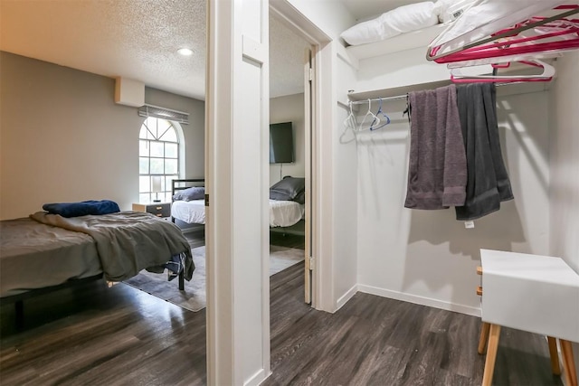 101 E 33rd St Unit 107, Austin, TX 78705 - spacious closet featuring dark wood-type flooring