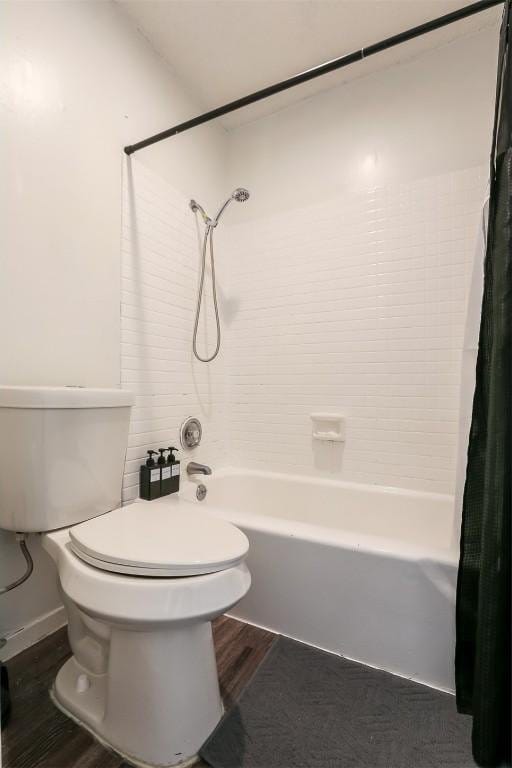 101 E 33rd St Unit 107, Austin, TX 78705 - bathroom with wood finished floors, shower / tub combo, and toilet