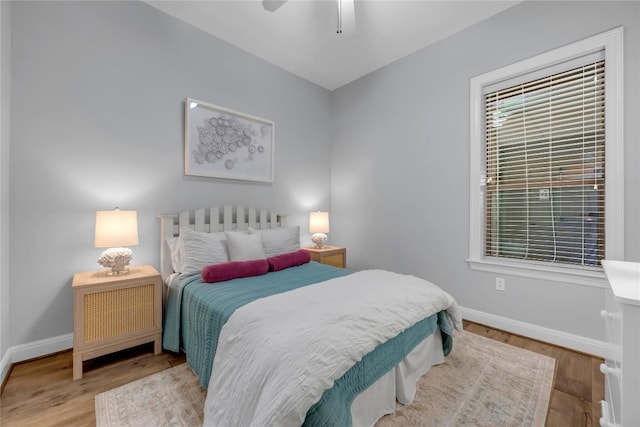 101 W Bank Unit 43, Llano, TX 78657 - bedroom with baseboards, wood finished floors, and ceiling fan