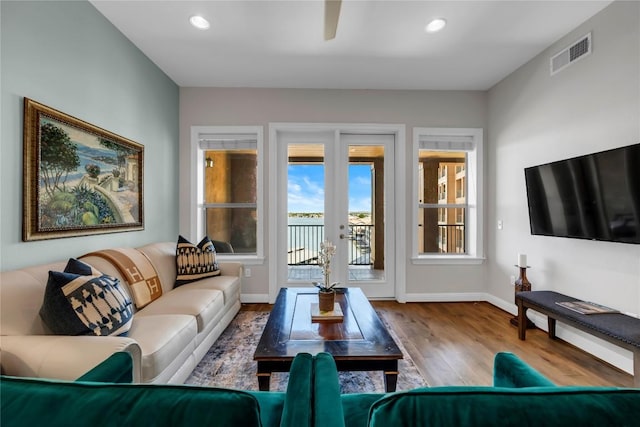 101 W Bank Unit 43, Llano, TX 78657 - living area featuring wood finished floors, baseboards, recessed lighting, ceiling fan, and french doors