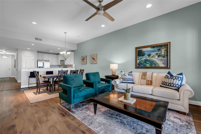 101 W Bank Unit 43, Llano, TX 78657 - living room featuring ceiling fan, wood finished floors, a chandelier, recessed lighting, and baseboards