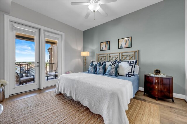 101 W Bank Unit 43, Llano, TX 78657 - bedroom featuring access to outside, light wood finished floors, a ceiling fan, and baseboards