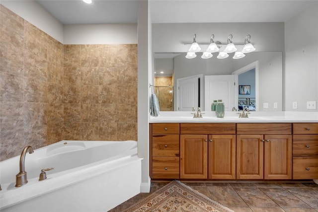 101 W Bank Unit 43, Llano, TX 78657 - full bathroom featuring a bath, vanity, and tile patterned flooring
