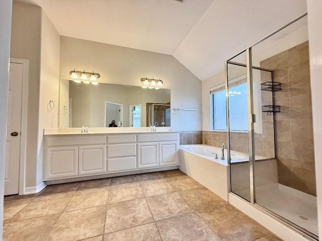 4233 Fairmeadow Dr, Round Rock, TX 78665 - full bath featuring a shower stall, a garden tub, lofted ceiling, and double vanity