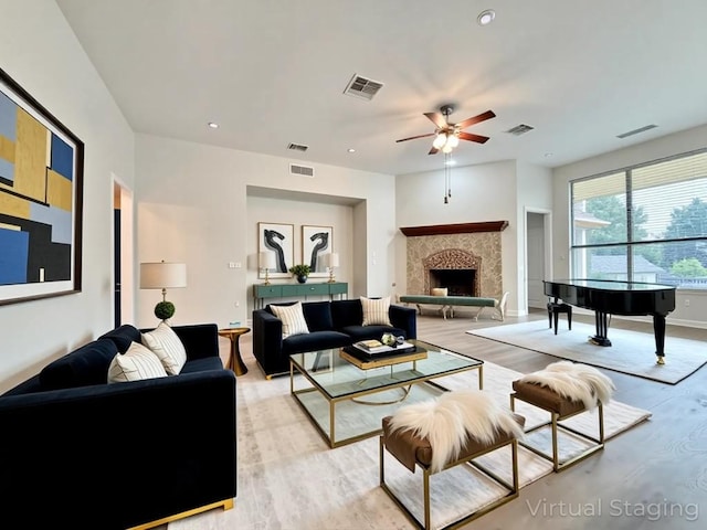 4233 Fairmeadow Dr, Round Rock, TX 78665 - living area with light wood finished floors, ceiling fan, a fireplace, baseboards, and recessed lighting