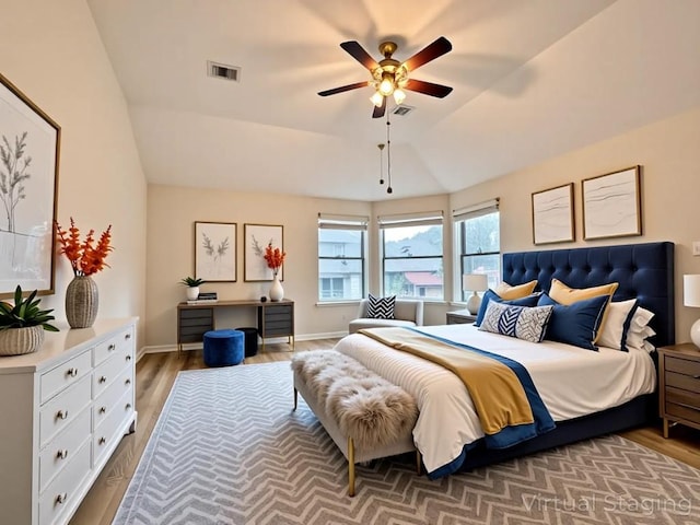 4233 Fairmeadow Dr, Round Rock, TX 78665 - bedroom with wood finished floors, vaulted ceiling, and ceiling fan