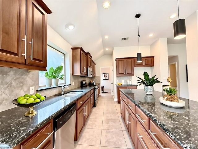 4233 Fairmeadow Dr, Round Rock, TX 78665 - kitchen featuring stainless steel appliances, a sink, tasteful backsplash, pendant lighting, and lofted ceiling
