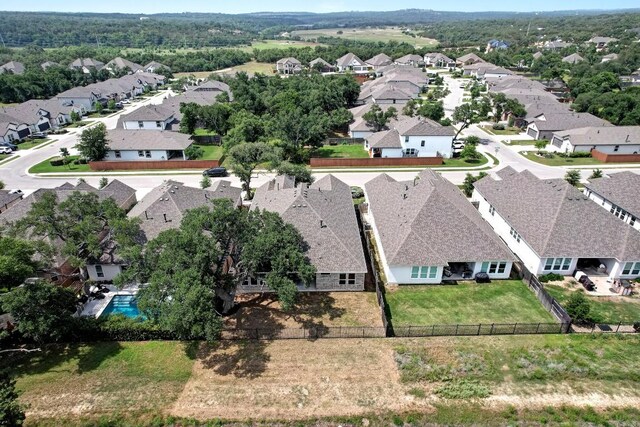 991 Arrowhead Ranch Blvd, Dripping Springs, TX 78620 - aerial perspective of suburban area featuring a pool area
