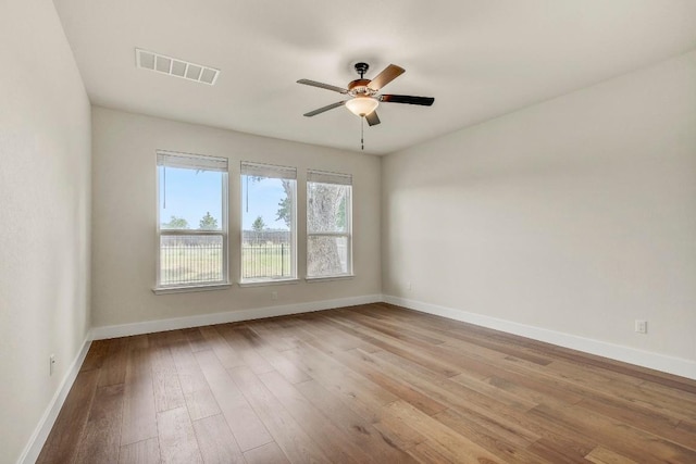 991 Arrowhead Ranch Blvd, Dripping Springs, TX 78620 - empty room featuring baseboards, hardwood / wood-style flooring, and ceiling fan