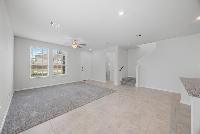 unfurnished living room with stairs, ceiling fan, recessed lighting, and baseboards