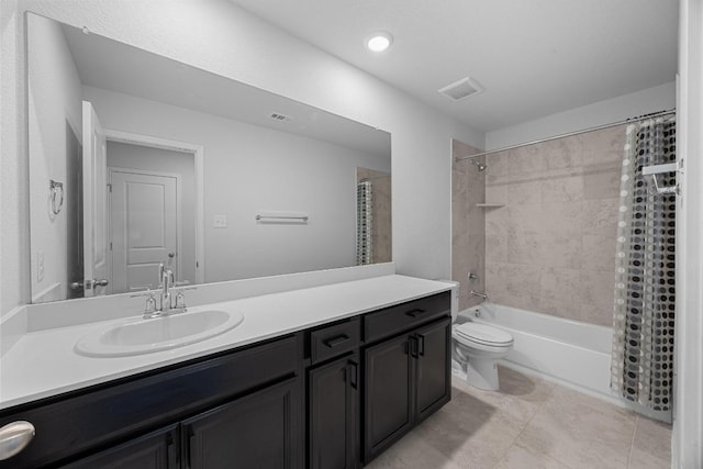 bathroom with vanity, toilet, shower / tub combo with curtain, and tile patterned floors