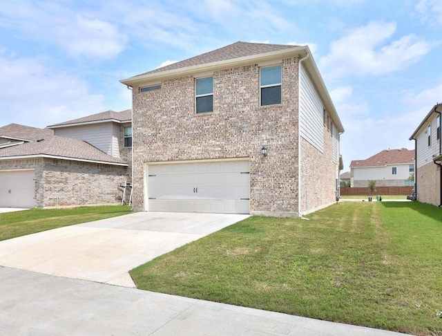 view of side of property with concrete driveway, a garage, a yard, and brick siding