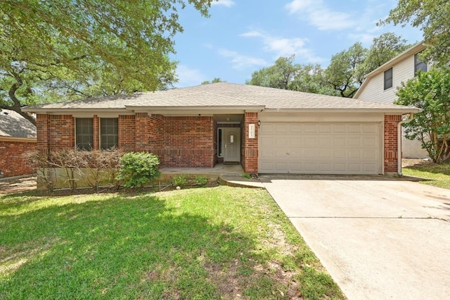 5705 Marchmont Ln, Austin, TX 78749 - view of front of property with a garage, a front lawn, driveway, and brick siding