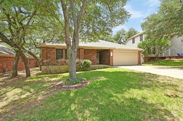 5705 Marchmont Ln, Austin, TX 78749 - view of front of property featuring concrete driveway, a garage, a front lawn, and brick siding