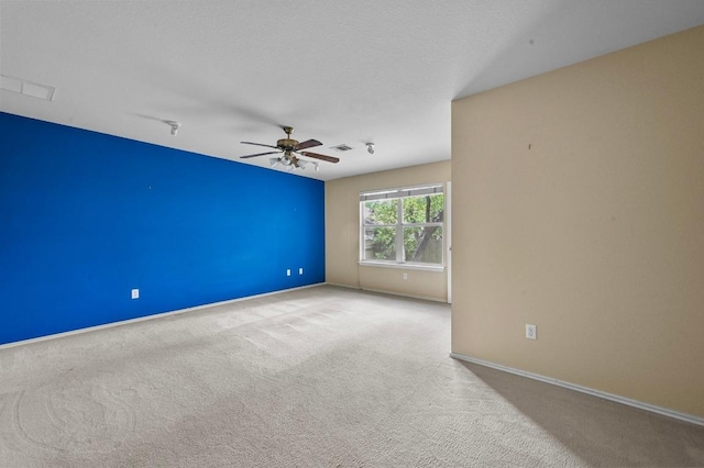5705 Marchmont Ln, Austin, TX 78749 - carpeted spare room featuring a ceiling fan and baseboards