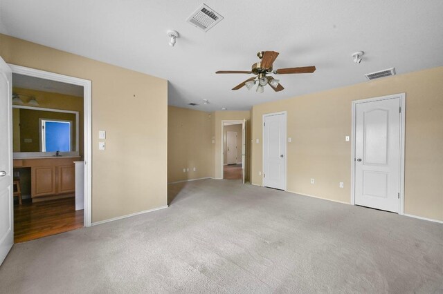 5705 Marchmont Ln, Austin, TX 78749 - spare room featuring carpet flooring, a ceiling fan, and baseboards