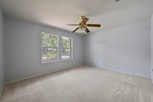 5705 Marchmont Ln, Austin, TX 78749 - unfurnished room featuring carpet, ceiling fan, and baseboards