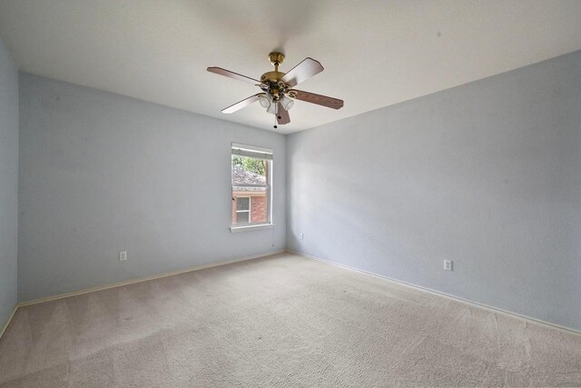 5705 Marchmont Ln, Austin, TX 78749 - carpeted spare room featuring a ceiling fan and baseboards