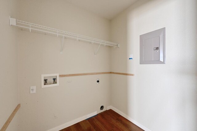 5705 Marchmont Ln, Austin, TX 78749 - clothes washing area featuring electric panel, hookup for a washing machine, dark wood-type flooring, hookup for an electric dryer, and baseboards