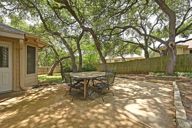 5705 Marchmont Ln, Austin, TX 78749 - view of patio with a fenced backyard and outdoor dining space