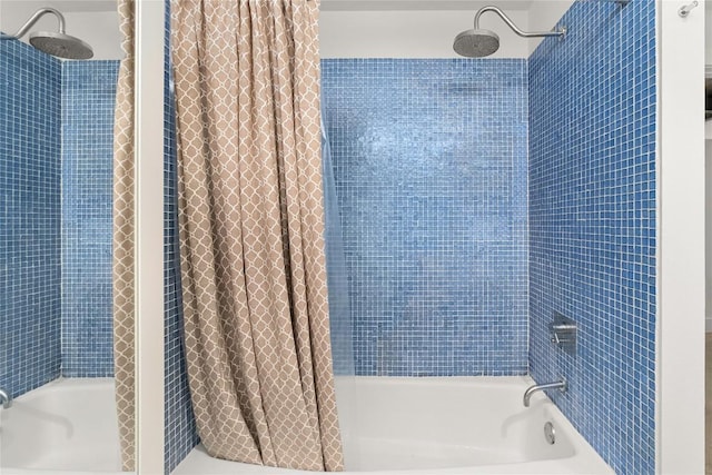 bathroom with shower / bathtub combination with curtain