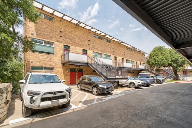 view of property featuring uncovered parking