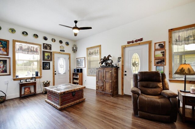 472 Mountain View Dr, Bandera, TX 78003 - living room with dark wood-style flooring, ceiling fan, and baseboards