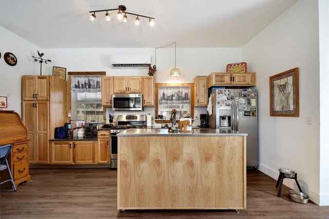 472 Mountain View Dr, Bandera, TX 78003 - kitchen featuring stainless steel appliances, a wall mounted air conditioner, a center island, dark wood-style flooring, and dark countertops