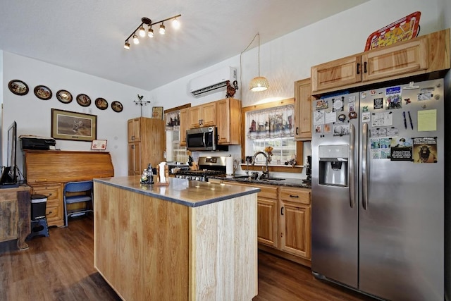 472 Mountain View Dr, Bandera, TX 78003 - kitchen with stainless steel appliances, dark wood-style flooring, a kitchen island, a sink, and an AC wall unit