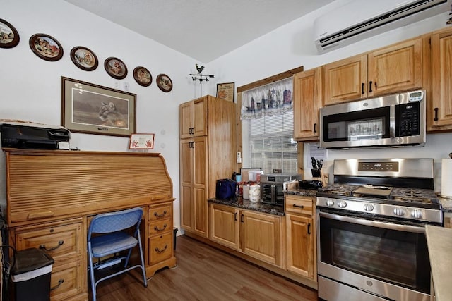 472 Mountain View Dr, Bandera, TX 78003 - kitchen featuring stainless steel appliances, a wall mounted AC, dark wood-type flooring, and vaulted ceiling
