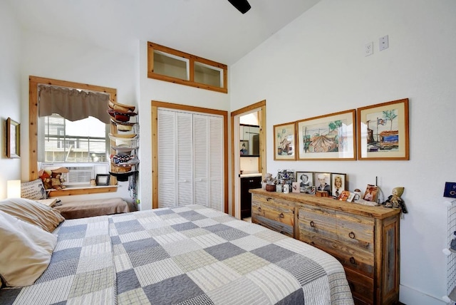 472 Mountain View Dr, Bandera, TX 78003 - bedroom featuring a closet, ceiling fan, high vaulted ceiling, and connected bathroom
