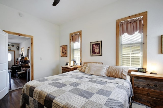 472 Mountain View Dr, Bandera, TX 78003 - bedroom with multiple windows, dark wood finished floors, and ceiling fan