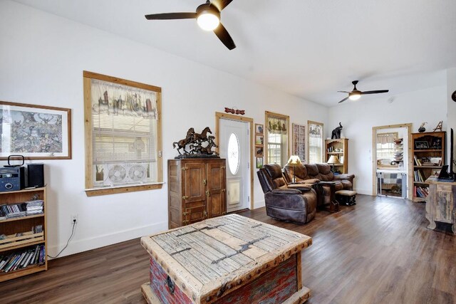 472 Mountain View Dr, Bandera, TX 78003 - living room featuring a ceiling fan, healthy amount of natural light, dark wood-type flooring, and baseboards