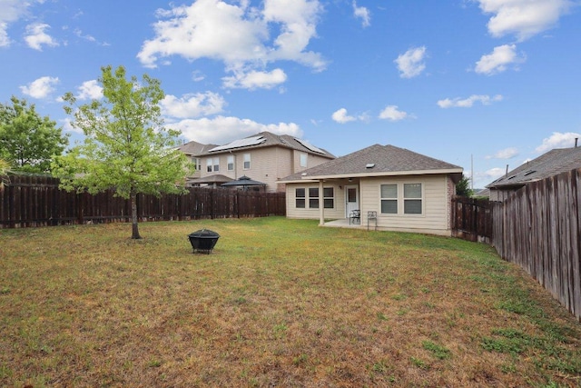1107 Cadence Dr, Pflugerville, TX 78660 - rear view of property featuring a patio area and an outdoor fire pit
