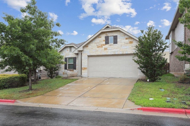1107 Cadence Dr, Pflugerville, TX 78660 - view of front of house with stone siding, driveway, a garage, and a front yard