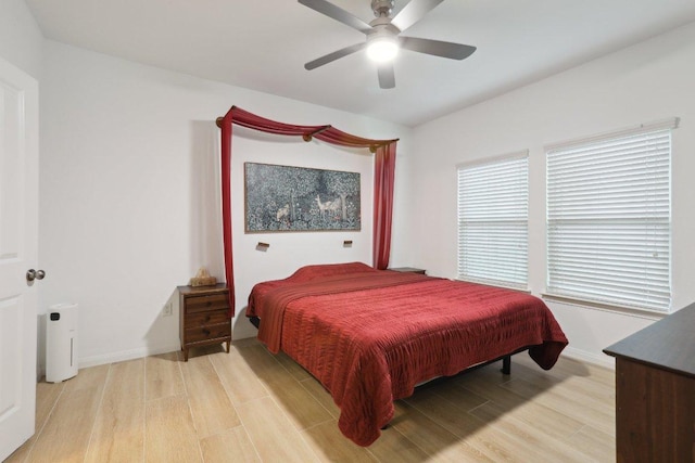 1107 Cadence Dr, Pflugerville, TX 78660 - bedroom featuring light wood-type flooring, baseboards, and a ceiling fan