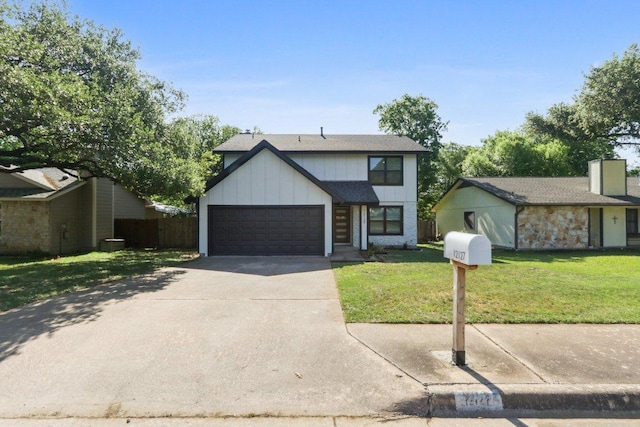 12127 Cabana Ln, Austin, TX 78727 - view of front of home with driveway, an attached garage, a front lawn, board and batten siding, and a chimney