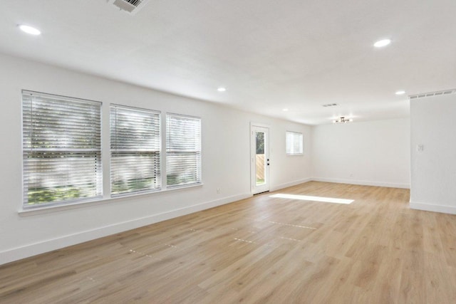 12127 Cabana Ln, Austin, TX 78727 - unfurnished living room featuring light wood finished floors, recessed lighting, and a chandelier