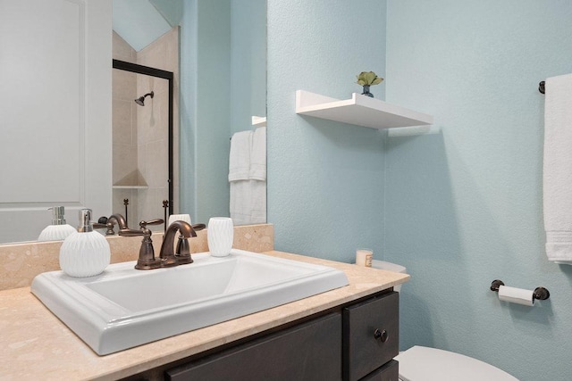 225 Cimarron Hills Trl E, Georgetown, TX 78628 - bathroom featuring vanity, tiled shower, and a textured wall