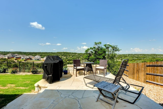 22208 Coyote Cave Trl, Spicewood, TX 78669 - fenced backyard featuring a patio area and area for grilling